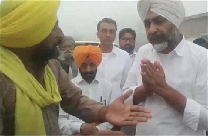 BJP candidate manpreet singh badal surrounded by questions from farmers during campaigning